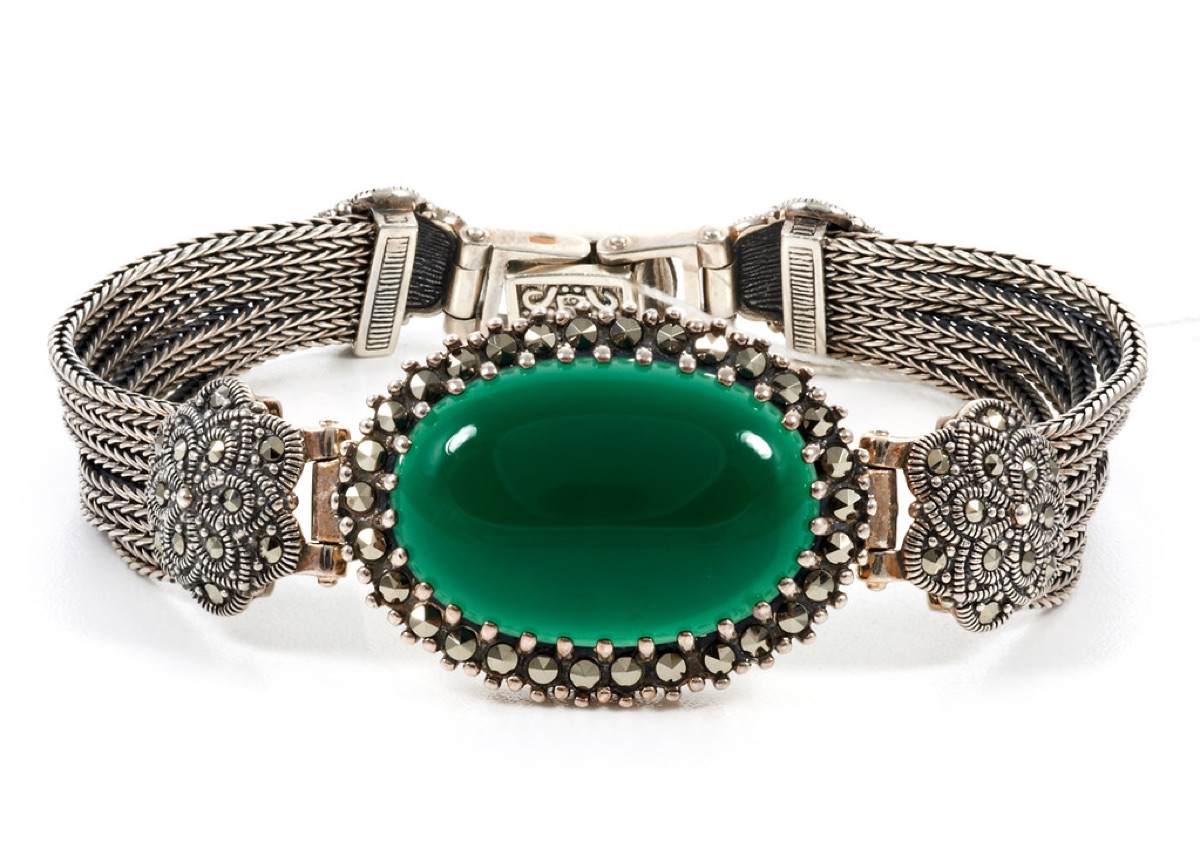 Silver bracelet with a green gemstone